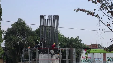 Construction workers work on a toll road pillar in Yogyakarta. Stock-Footage 341835128