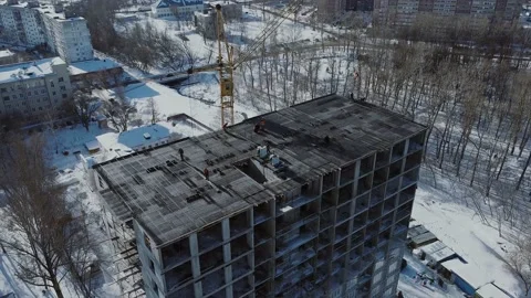 Construction workers work at the top of the building under construction. Stock Footage 150426128