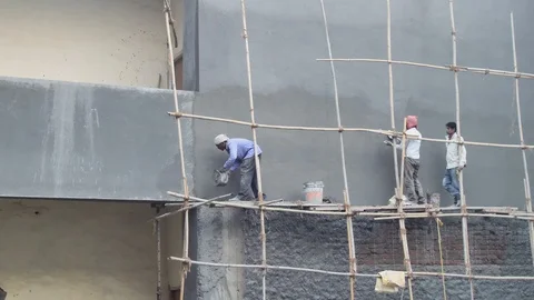 Construction workers working on a building construction site Stock Footage 85904627