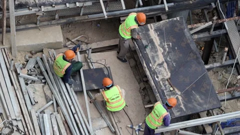 Construction workers working on a building framework. Video stock 316098988