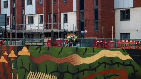 Construction workers working on a building on Oxford Street Leicester UK. Stock Footage 241099033