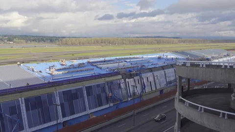 Construction workers working on Concourse E at Portland Airport. Stock-Footage 134668901