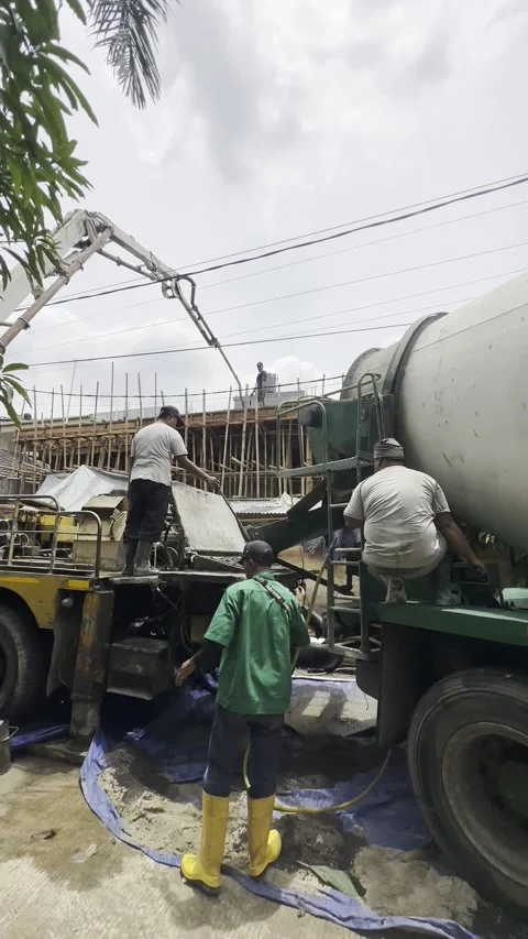 Construction workers working with concrete pump &amp; mill truck for a house Stock Footage 237176593
