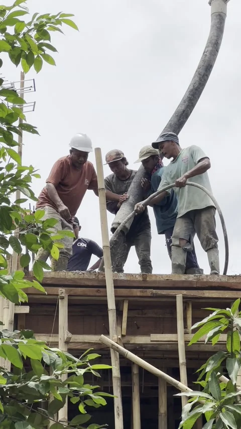Construction workers working with concrete pump &amp; mill truck for a house Stock Footage 237177821