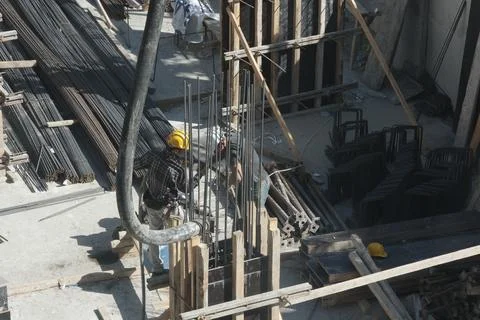 Construction workers working at the construction site Stock Photos