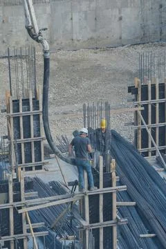 Construction workers working at the construction site Stock Photos