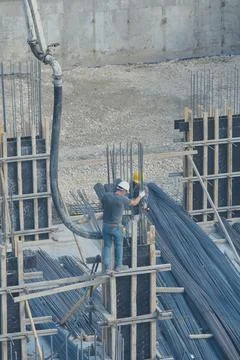 Construction workers working at the construction site Stock Photos