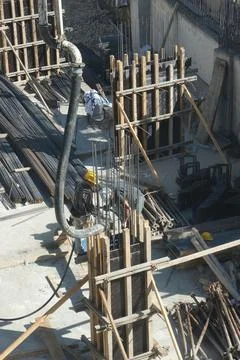Construction workers working at the construction site Stock Photos