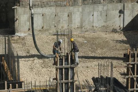 Construction workers working at the construction site Stock-Fotos