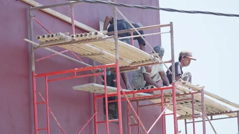 Construction Workers Working on a High-Rise Building Stock Footage 345618605