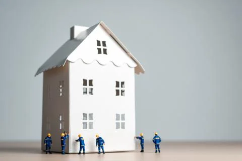 Construction workers working on a new home Stock Photos