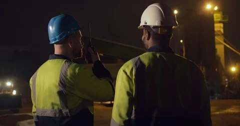 Construction workers working at night in construction site. Concept of hard work Stock Footage 124303936