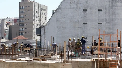 Construction workers working for the preparation of concreting on the roof of Stock-Footage 116945136