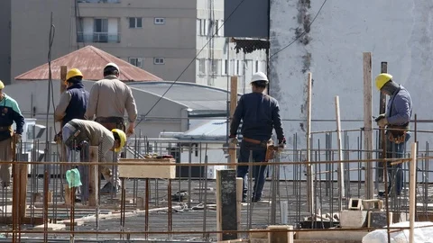 Construction workers working for the preparation of concreting on the roof of Stock-Footage 116948060