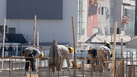 Construction workers working for the preparation of concreting on the roof of Stock-Footage 116978952