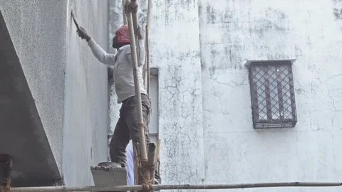 Construction workers working scaffolding on a building construction site Stock Footage 85890275