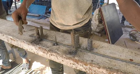 Construction workers working at the steel reinforcement bar bending yard in t Stock Footage 93484397