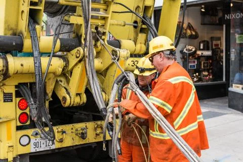 Construction workers working on street Stock Photos