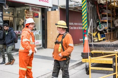 Construction workers working on street Stock Photos