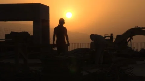 Construction Workers Working on The Sunset Silhouette 库存影片 98761962