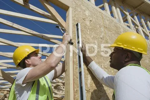 Construction Workers Working Together Stock Photos