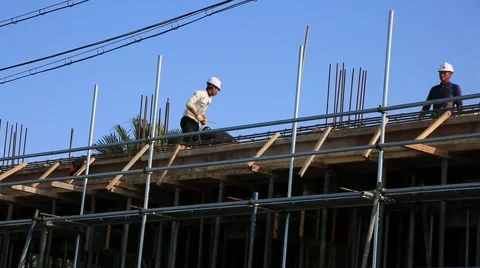 Construction workers working on the top of the building Video stock 58640700