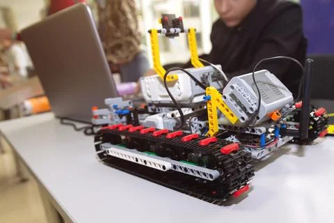 Construction workflow of electronic car with microcontroller at junior robo.. 写真素材