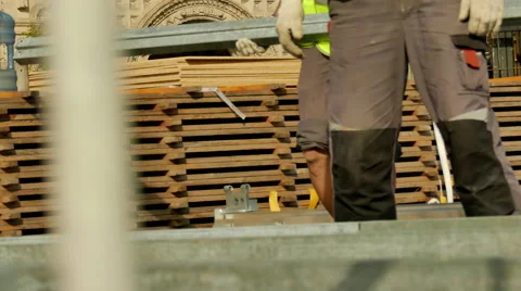 Construction workier moving timber Stock Footage 67321970