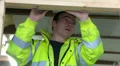 Construction working nailing wood in place HD Footage