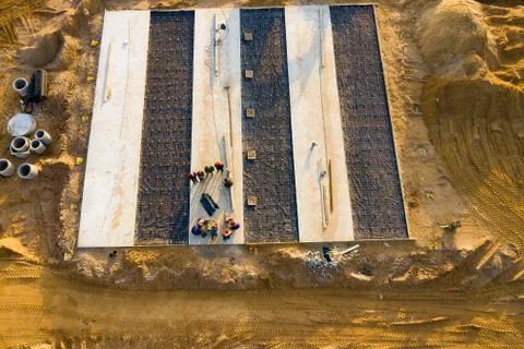 Construction work.Placing concrete foundations. Stock Photos