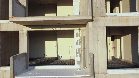 Construction works of a building with scaffolding on the facade. View from the Video stock 145157607