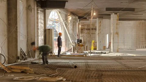 Construction works with circular abrasive cutoff saw angle grinding machine.. Stock Photos