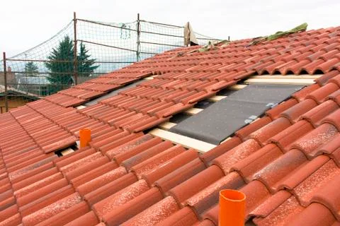 Construction works of construction and insulation of a roof Stock Photos