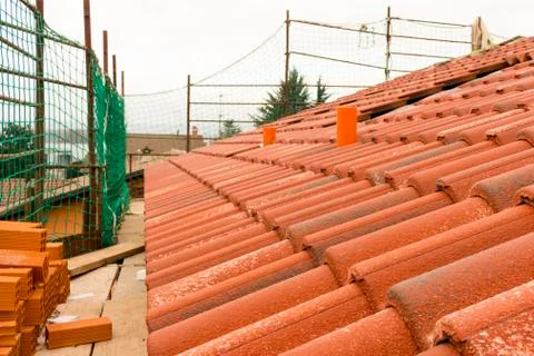 Construction works of construction and insulation of a roof Stock Photos