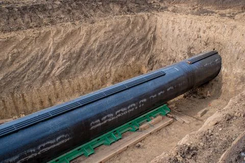 Construction works for laying the pipe. Stock Photos