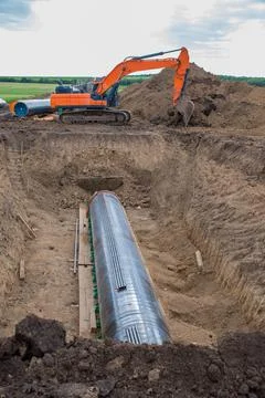 Construction works for laying the pipe. Stock Photos