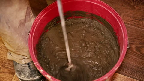 Construction works. Stir the tile adhesive. Stock Footage 168027226