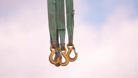 Construction works. Worker using hooks and slings in a construction site. Stock Footage 342593319