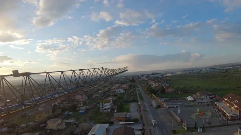 Construction yard crane at dawn shot in FPV Stock Footage 171541471