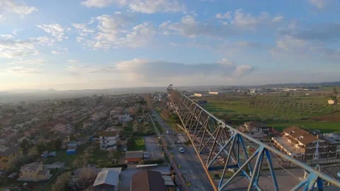 Construction yard crane at dawn shot in FPV Stock Footage 171541936