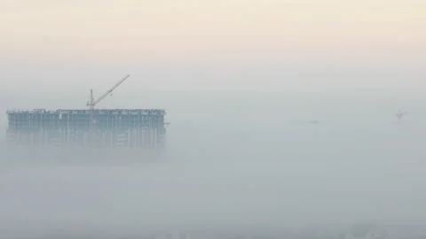 Construction.Construction crane.Tall building.Fog. Stock Footage 121496246