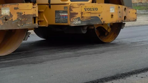 Constructions Workers Working on Road. Team of workers put the hot asphalt Video stock 153324531