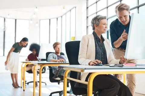 Constructive criticism is welcomed here. Shot of a group of creative designers Stock Photos