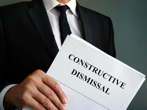 Constructive dismissal agreement papers in the hands. Foto stock