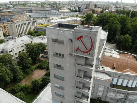 Constructivism building red hammer and sickle monument. USSR symbols. Narvskaya Photos