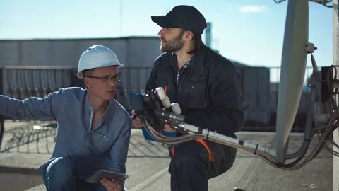 Constructor and taskmaster discussing Stock Footage 77428729