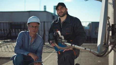 Constructor and taskmaster looking at camera Stock Photos