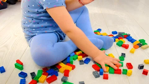 Constructor child plays in the room. Selective focus. Stock Footage 237447298