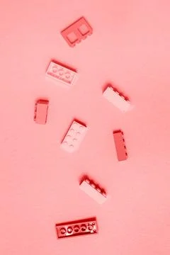 Constructor children plastic colored on a pastel pink Stock Photos