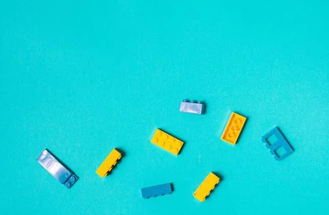 Constructor children plastic multi-colored on a pastel blue Stock Photos